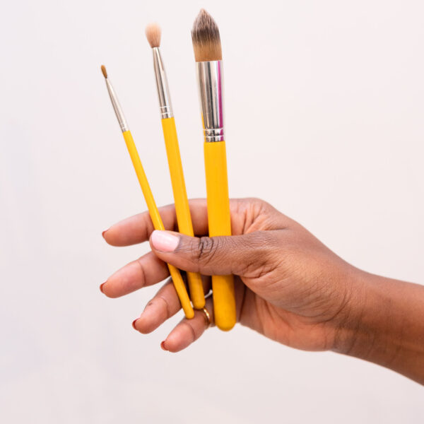 woman holding pain brushes lifestyle branding